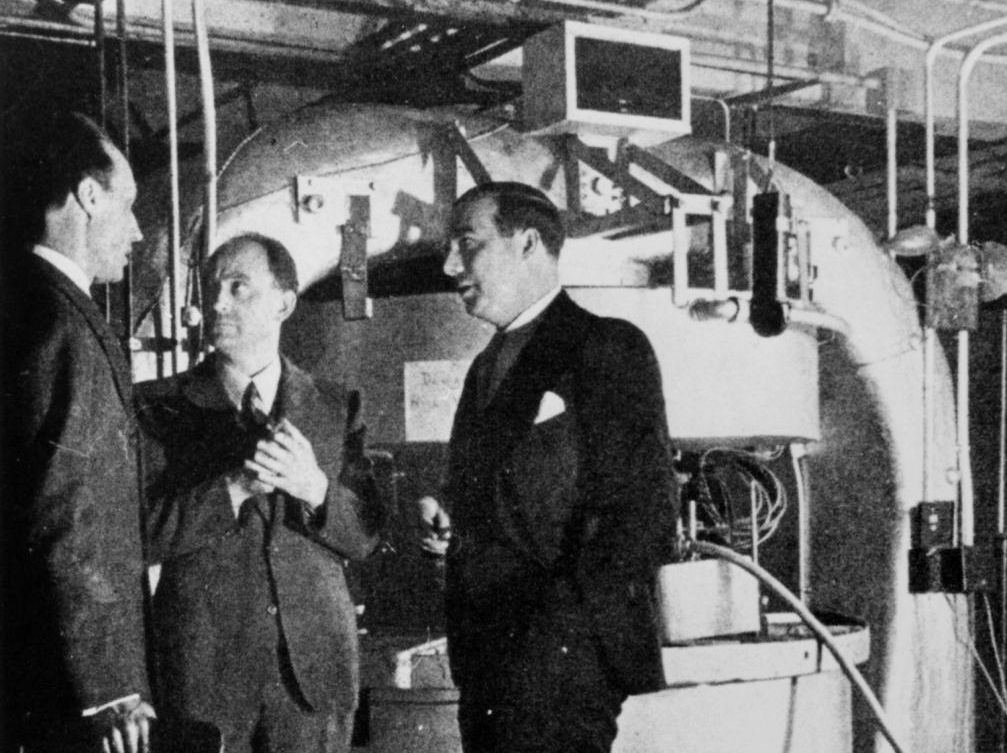 Dunning, Fermi and Mitchell in Front of the Cyclotron Msgnets